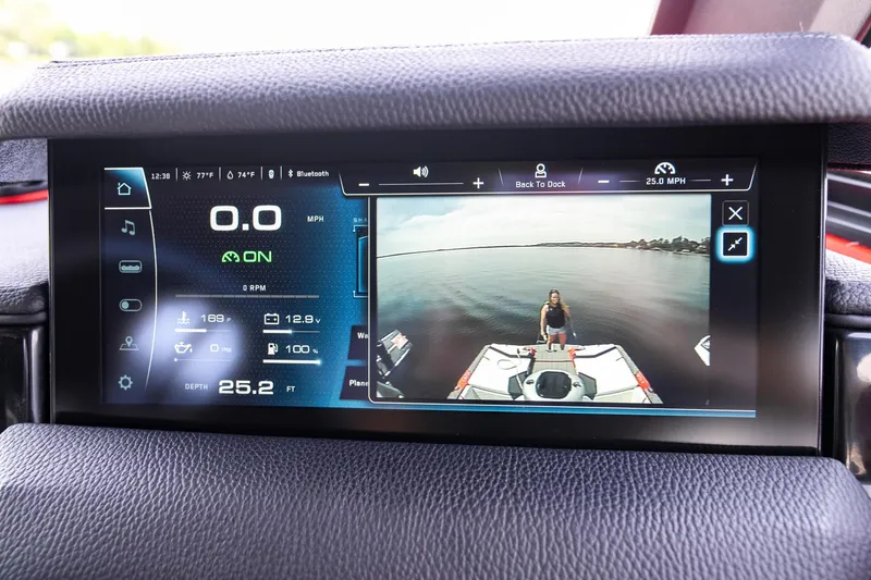 Slide: The Image of 2026 Nautique Super Air Nautique GS22 dashboard display with rearview camera and control interface. - 6