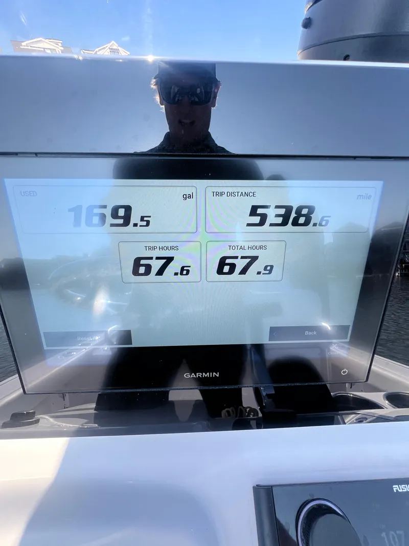 Slide: The Image of Display screen on 2023 Sportsman Masters 207 Bay Boat showing trip data and fuel usage. - 16