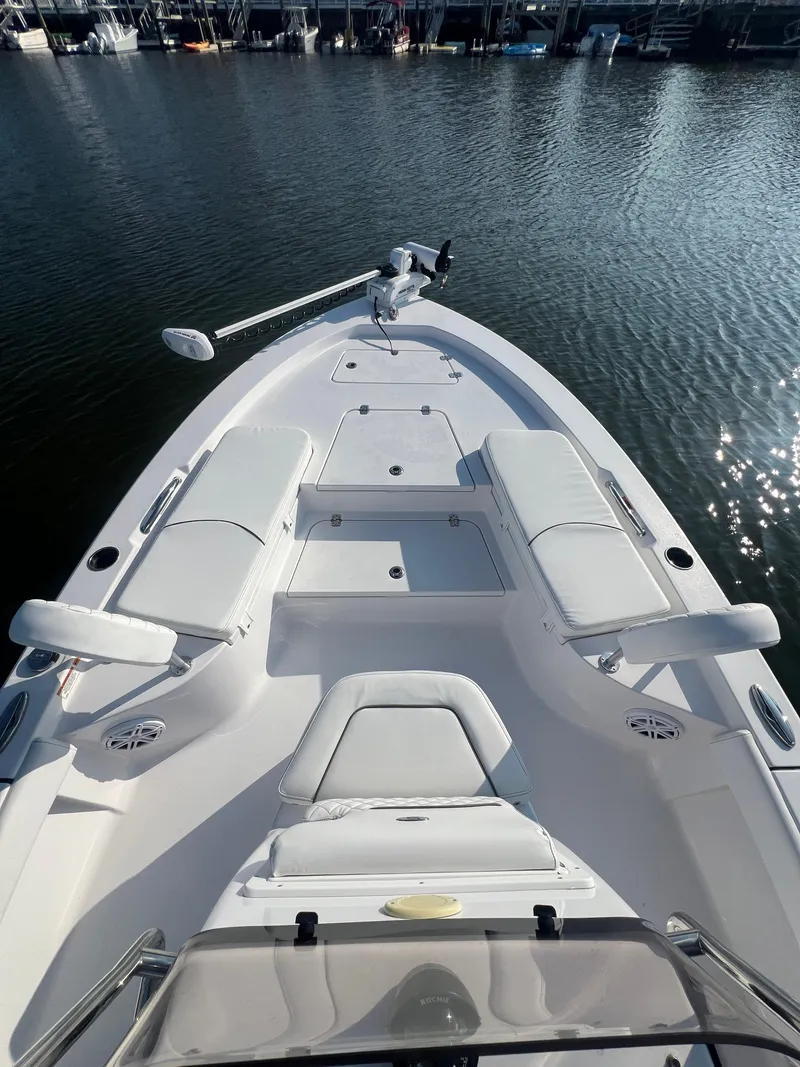 Slide: The Image of 2023 Sportsman Masters 207 Bay Boat with sleek white seating and spacious deck. - 6