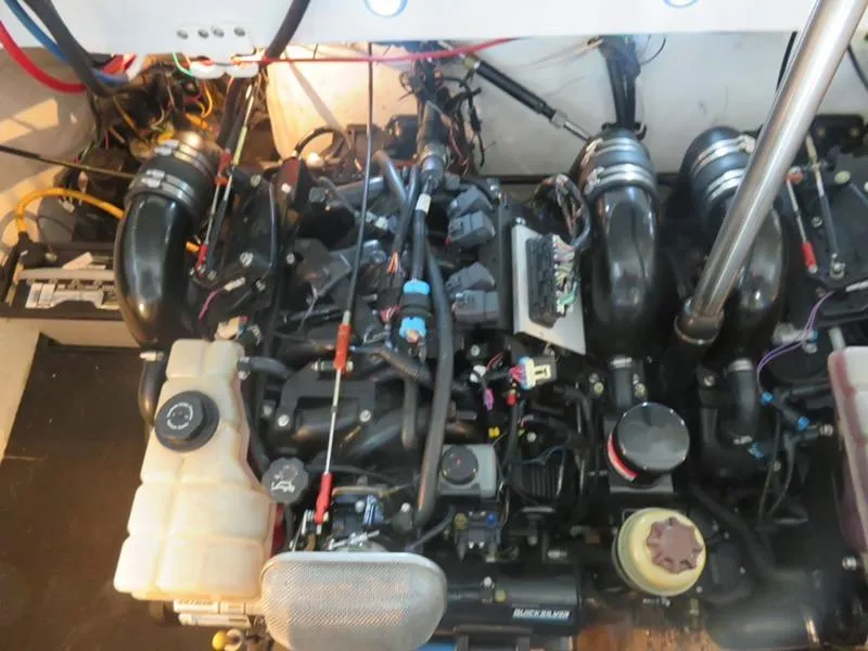 Slide: The Image of Engine compartment of a 2005 Cobalt 360 boat, showcasing complex wiring and components. - 17