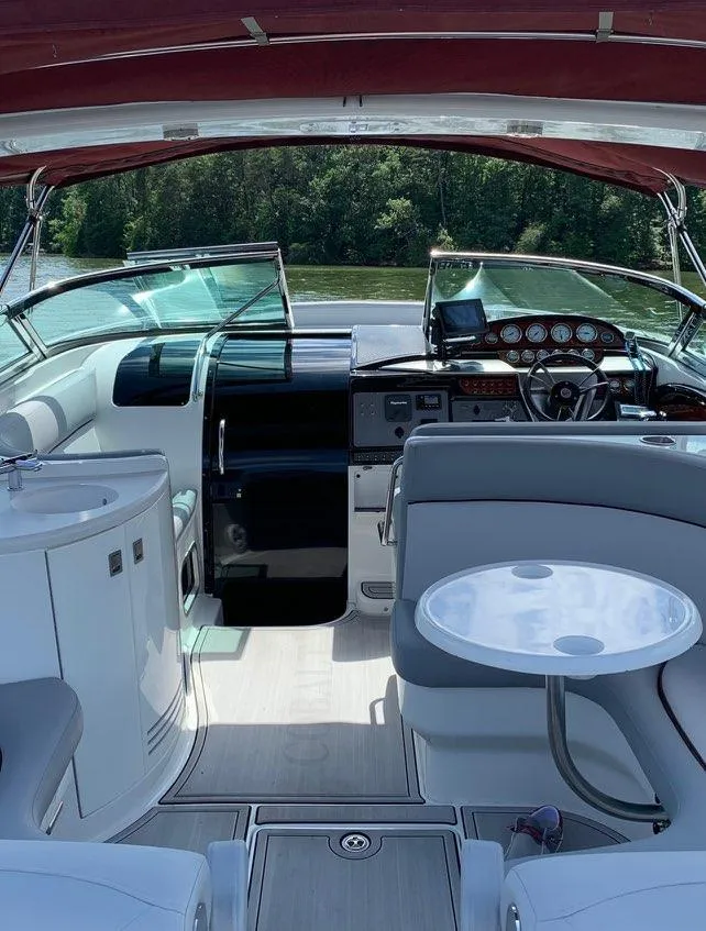 Slide: The Image of Interior of a 2005 Cobalt 360 boat with seating and control panel. - 8