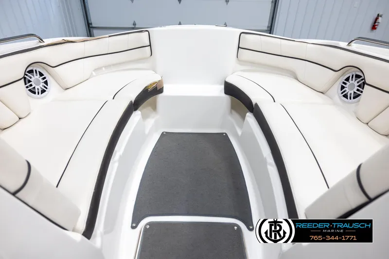 Slide: The Image of Interior view of 2013 Yamaha Boats 210 SX with white seating and speakers. - 15