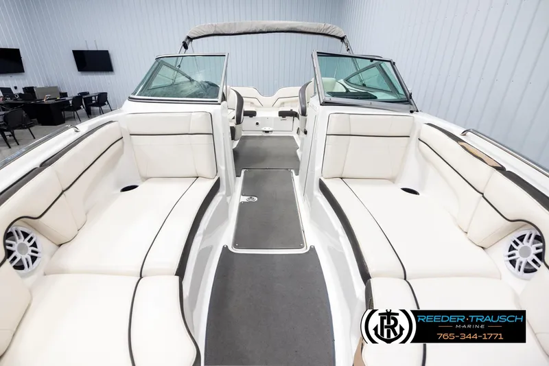 Slide: The Image of 2013 Yamaha Boats 210 SX interior with white seating and modern design. - 17