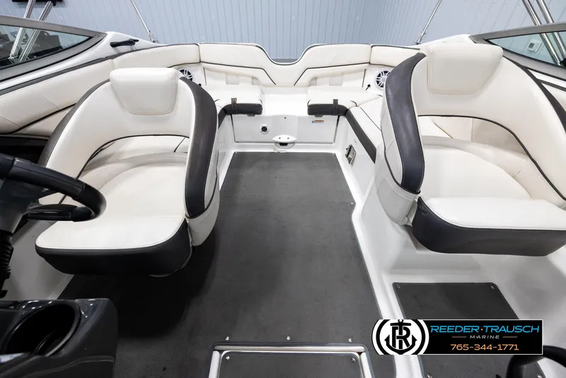 Slide: The Image of Interior of a 2013 Yamaha Boats 210 SX with white and black seating. - 18