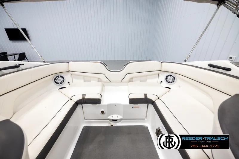Slide: The Image of 2013 Yamaha Boats 210 SX interior with white seating and speakers. - 19
