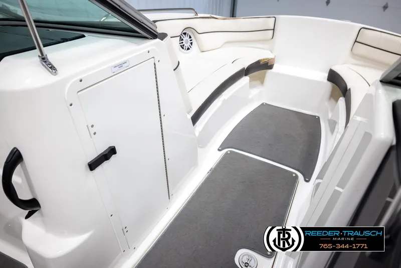 Slide: The Image of 2013 Yamaha Boats 210 SX interior with seating and storage compartments. - 21