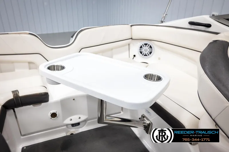 Slide: The Image of Interior of 2013 Yamaha Boats 210 SX with table and cup holders. - 24