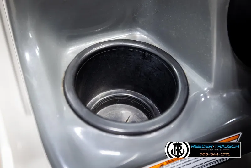 Slide: The Image of Cup holder in 2013 Yamaha Boats 210 SX, featuring sleek gray design. - 29