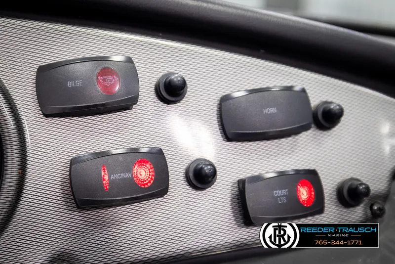 Slide: The Image of Control panel of a 2013 Yamaha Boats 210 SX with labeled switches and buttons. - 32