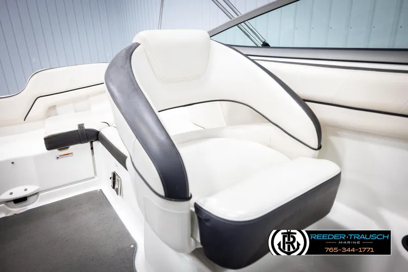 Slide: The Image of 2013 Yamaha Boats 210 SX interior seating with white and black upholstery. - 37