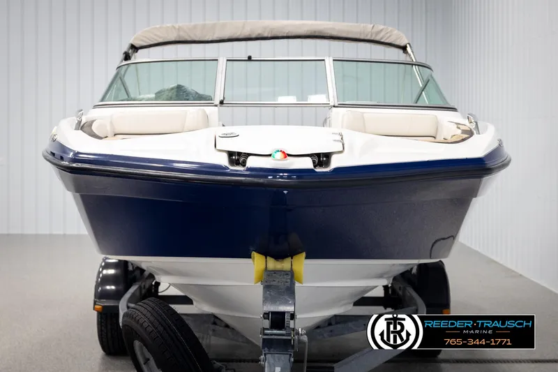 Slide: The Image of 2013 Yamaha Boats 210 SX on trailer, front view in showroom. - 8