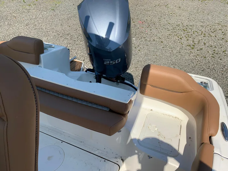 Slide: The Image of 2026 Pioneer 222 Islander boat with Yamaha 250 engine and tan seating. - 12