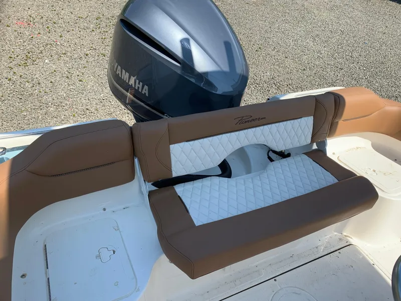 Slide: The Image of 2026 Pioneer 222 Islander boat with Yamaha engine, featuring brown and white seating. - 13