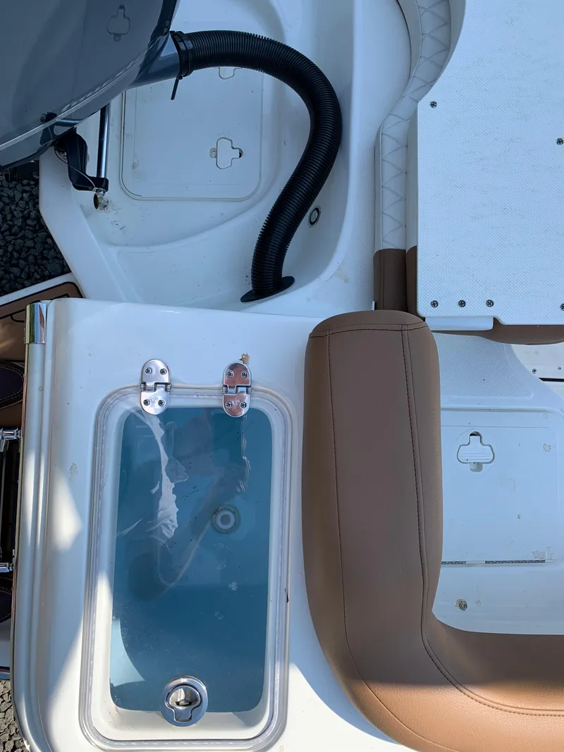 Slide: The Image of 2026 Pioneer 222 Islander boat interior with seating and storage compartments. - 20