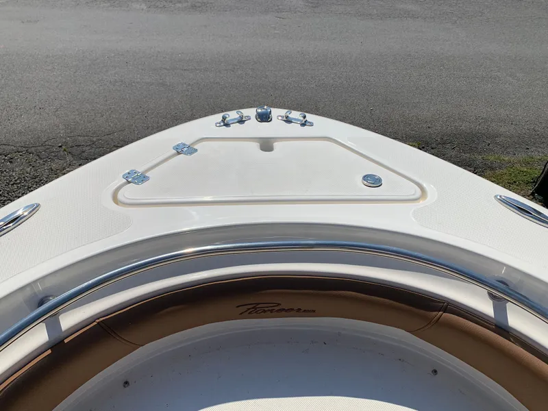 Slide: The Image of Bow of 2026 Pioneer 222 Islander boat with sleek design and storage compartment. - 5