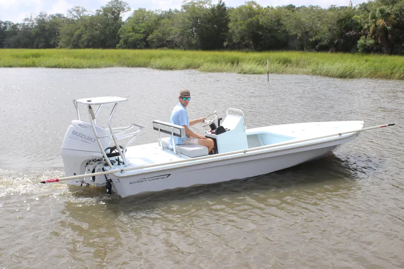 Slide: The Image of 2026 East Cape EVO 18V boat on trailer, displayed outdoors. - 1
