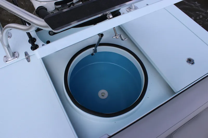 Slide: The Image of 2026 East Cape EVO 18V boat on trailer in a marina setting. - 12