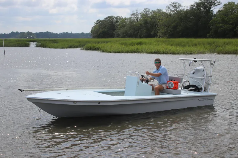 Slide: The Image of 2026 East Cape EVO 18V boat on trailer, aerial view, light blue color. - 2