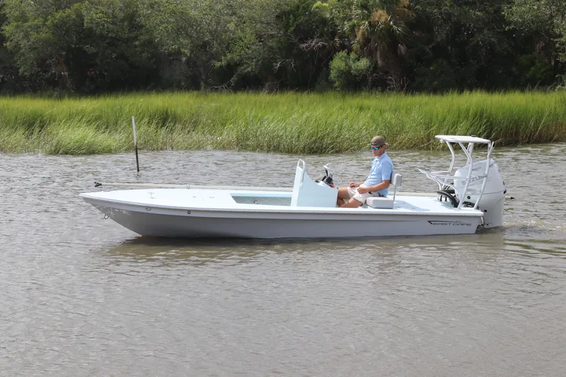 Slide: The Image of 2026 East Cape EVO 18V boat with Suzuki outboard motor on water. - 4