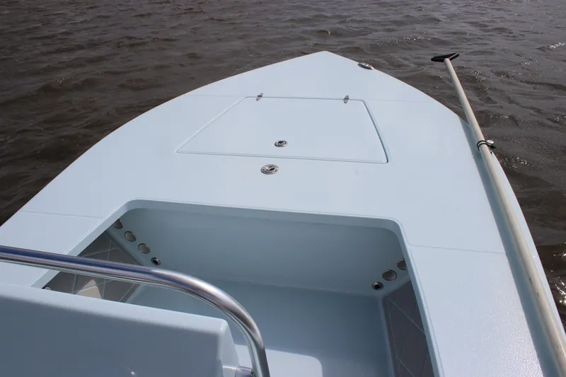 Slide: The Image of 2026 East Cape EVO 18V boat with motor on water, rear view. - 9