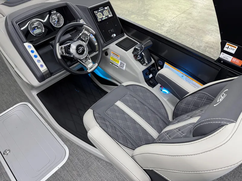Slide: The Image of 2025 Barletta Lusso 25UC boat interior with modern dashboard and luxurious seating. - 10