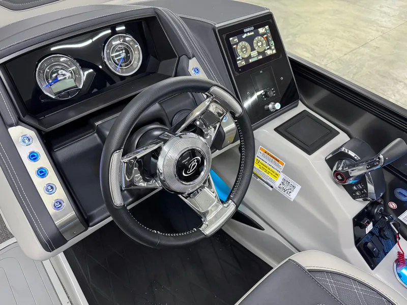 Slide: The Image of 2025 Barletta Lusso 25UC boat dashboard with steering wheel and control panel. - 12