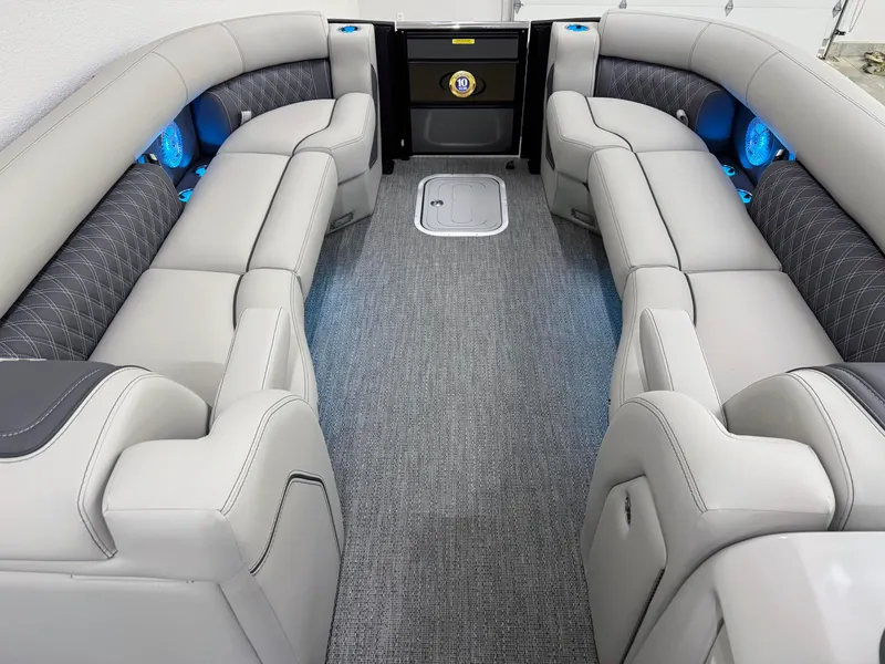 Slide: The Image of Luxurious interior of 2025 Barletta Lusso 25UC pontoon boat with plush seating and ambient lighting. - 16