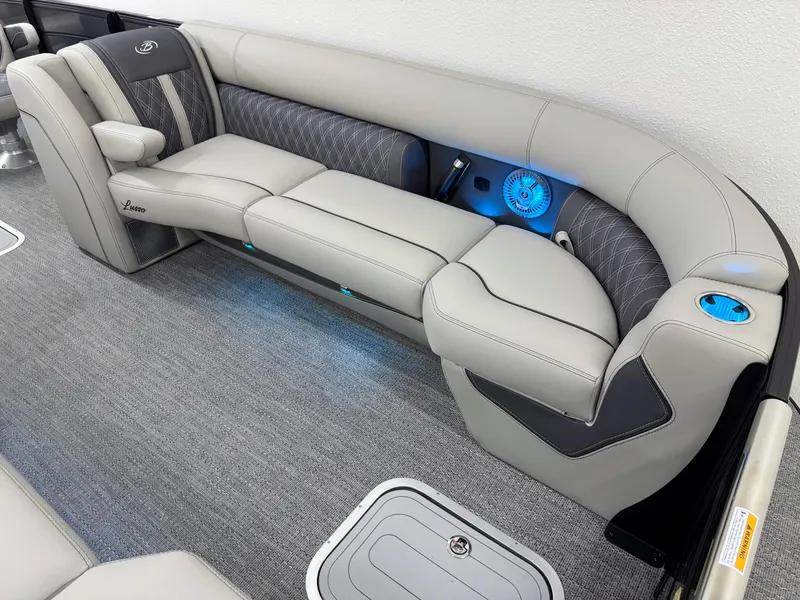 Slide: The Image of Luxurious seating in 2025 Barletta Lusso 25UC pontoon boat with elegant design and blue LED lighting. - 18