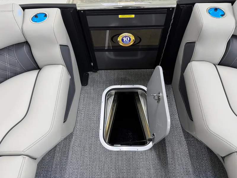 Slide: The Image of 2025 Barletta Lusso 25UC interior with open storage compartment and luxurious seating. - 20