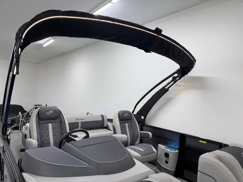 Slide: The Image of 2025 Barletta Lusso 25UC pontoon boat interior with luxury seating and canopy. - 21