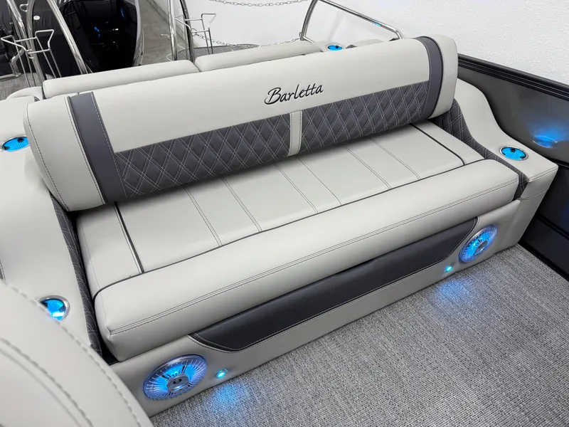 Slide: The Image of 2025 Barletta Lusso 25UC boat interior with luxurious seating and blue LED lighting. - 7