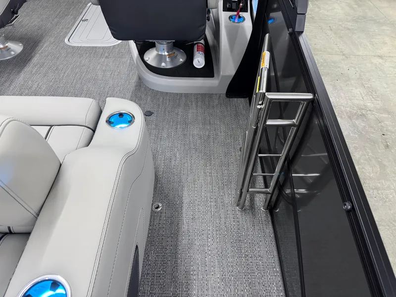 Slide: The Image of Interior of 2025 Barletta Lusso 25UC pontoon boat with seating and ladder. - 8