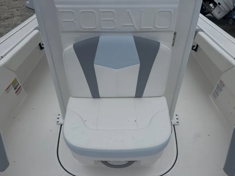 Slide: The Image of 2025 Robalo 246 Cayman boat seat with gray and white upholstery. - 11