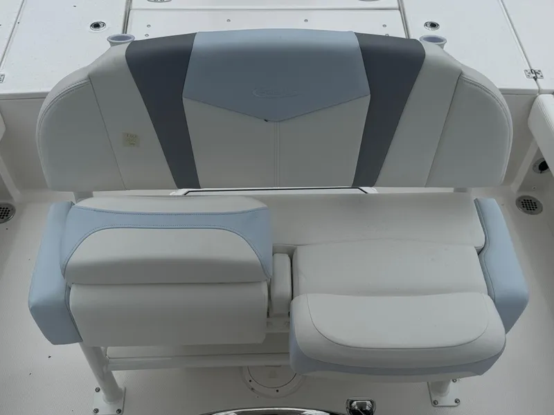 Slide: The Image of 2025 Robalo 246 Cayman boat seat with blue and gray upholstery. - 17
