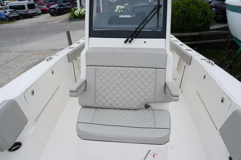 Slide: The Image of 2024 Pursuit S 248 Sport boat interior with quilted seating and sleek design. - 12