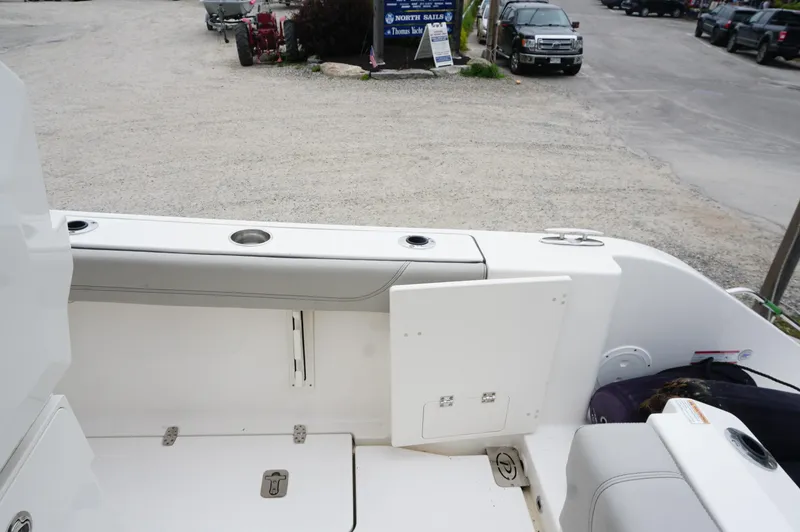 Slide: The Image of 2024 Pursuit S 248 Sport boat interior with seating and storage compartments. - 23