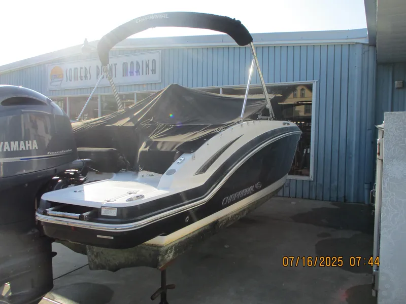 Slide: The Image of 2019 Chaparral 210 Suncoast boat at Somers Point Marina, covered and docked. - 15