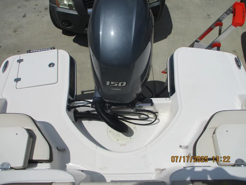Slide: The Image of 2019 Chaparral 210 Suncoast boat with Yamaha 150 outboard motor, viewed from above. - 26
