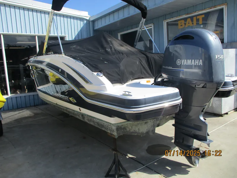 Slide: The Image of 2019 Chaparral 210 Suncoast boat with Yamaha 150 outboard motor, docked near bait shop. - 7