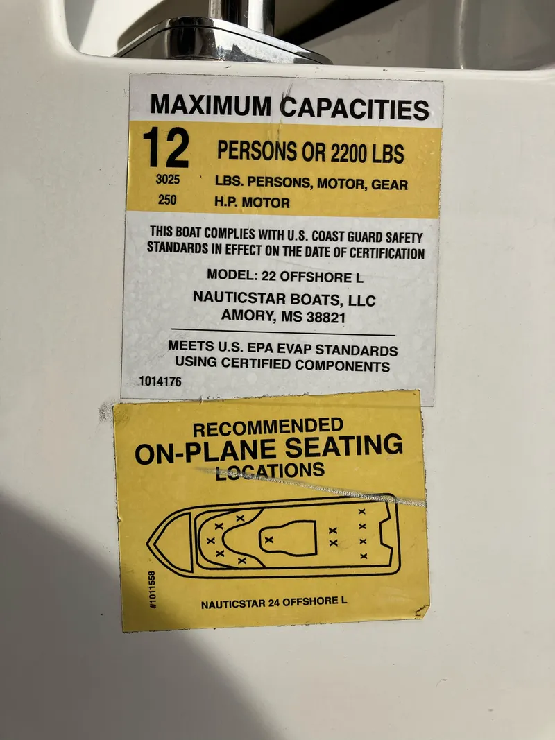 Slide: The Image of Capacity label for 2023 NauticStar 22L boat, 12 persons or 2200 lbs, seating diagram included. - 8