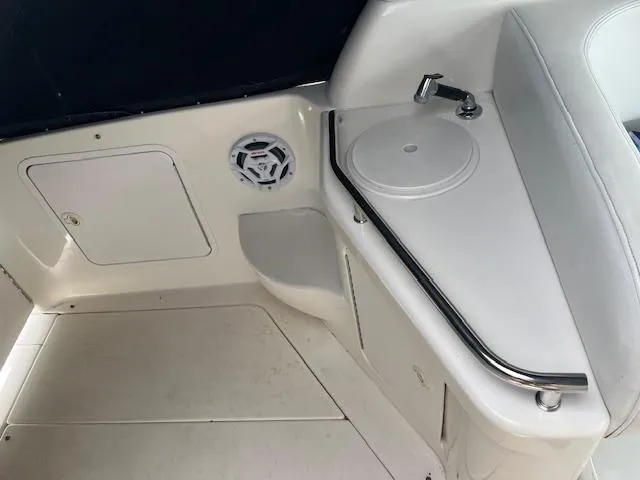 Slide: The Image of Interior of 1998 Sea Ray 290 Sundancer boat with sink and speaker. - 10