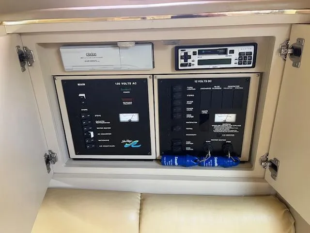 Slide: The Image of Electrical control panel of a 1998 Sea Ray 290 Sundancer boat. - 15