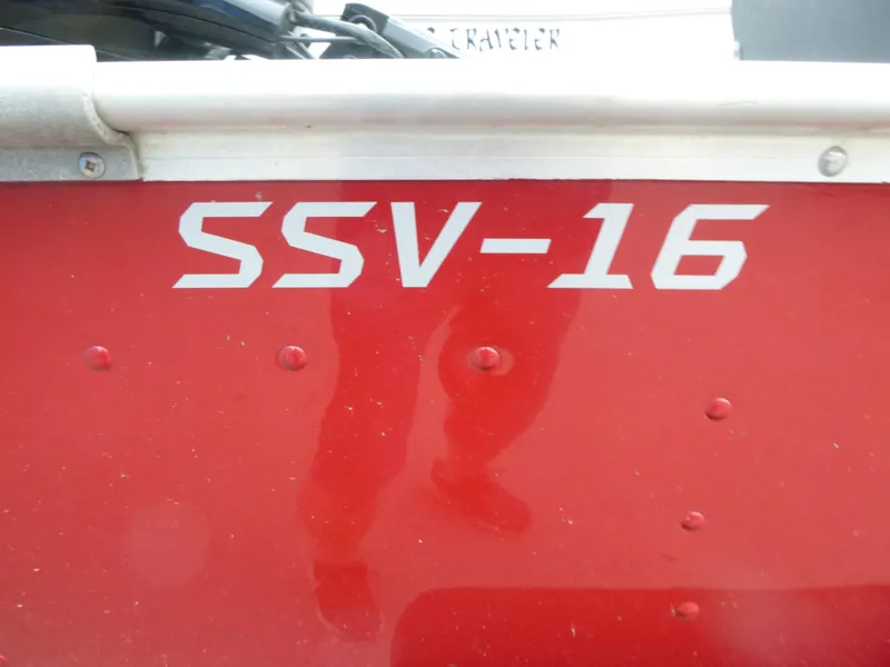 Slide: The Image of Red 2022 Lund SSV-16 boat exterior with model number displayed. - 10
