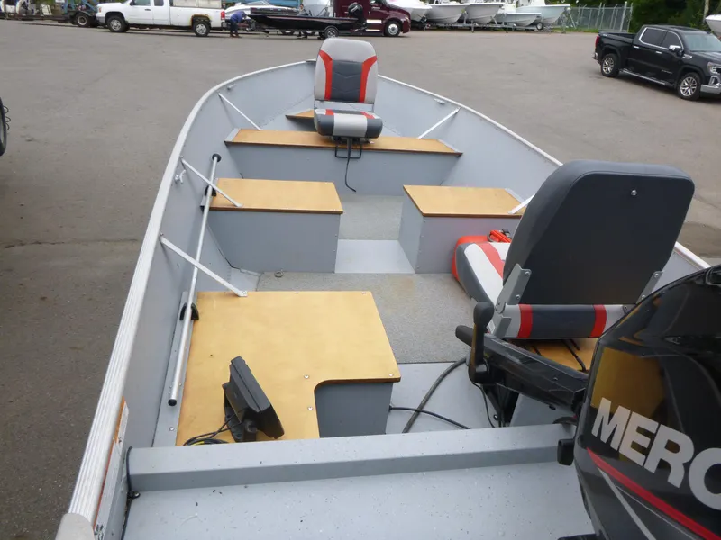 Slide: The Image of 2022 Lund SSV-16 boat interior with seating and Mercury outboard motor. - 5