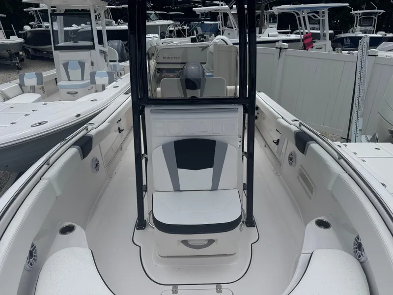 Slide: The Image of 2025 Robalo R222 Center Console boat interior with seating and console view. - 10