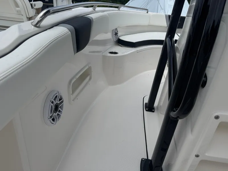 Slide: The Image of 2025 Robalo R222 Center Console boat interior with seating and speaker detail. - 18