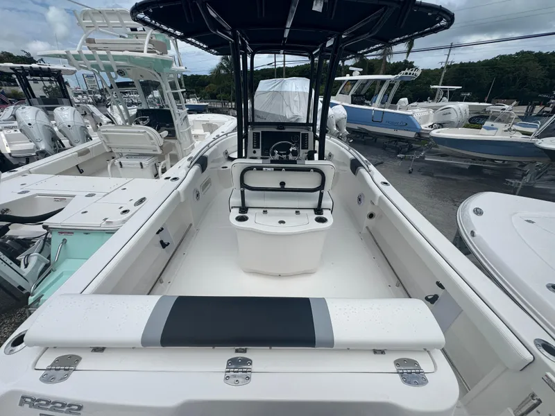 Slide: The Image of 2025 Robalo R222 Center Console boat with spacious seating and modern design. - 2