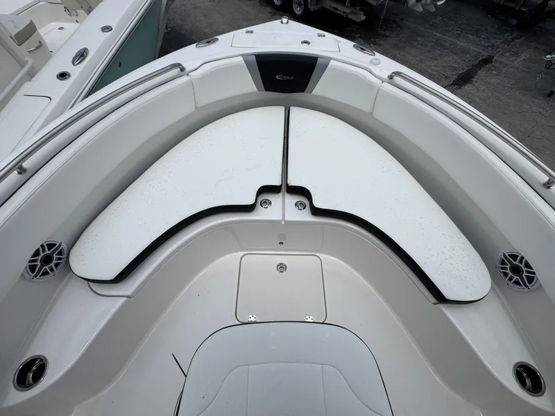 Slide: The Image of 2025 Robalo R222 Center Console boat interior with cushioned seating and sleek design. - 20