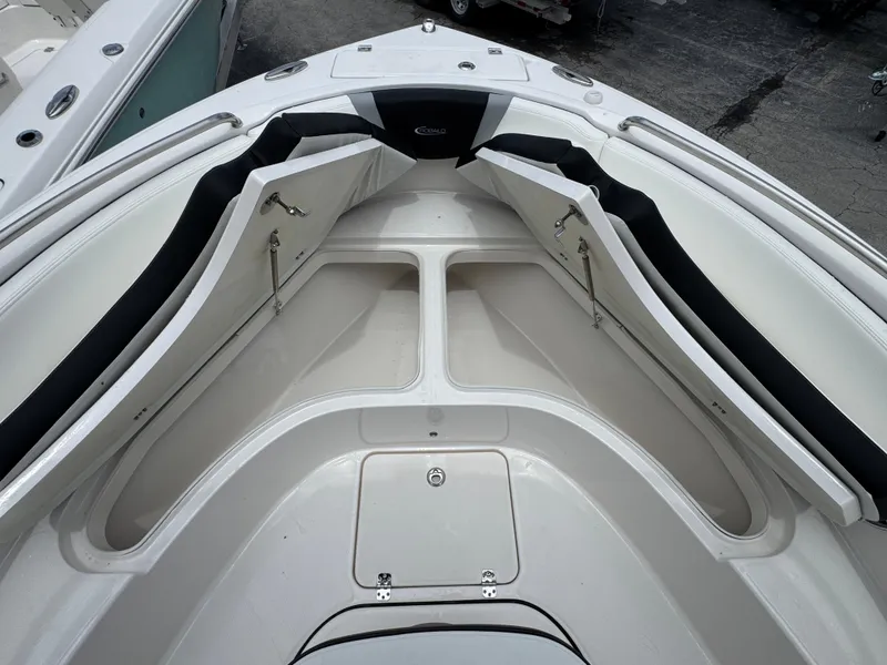 Slide: The Image of 2025 Robalo R222 Center Console boat interior with open storage compartments. - 21