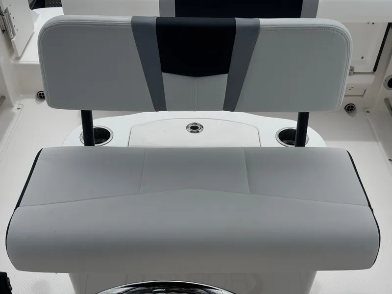 Slide: The Image of 2025 Robalo R222 Center Console boat seat with cup holders, featuring sleek design and comfort. - 24